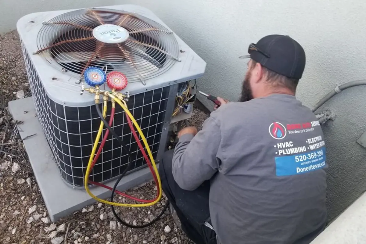 Done Rite Services technician working on a condenser during an emergency call