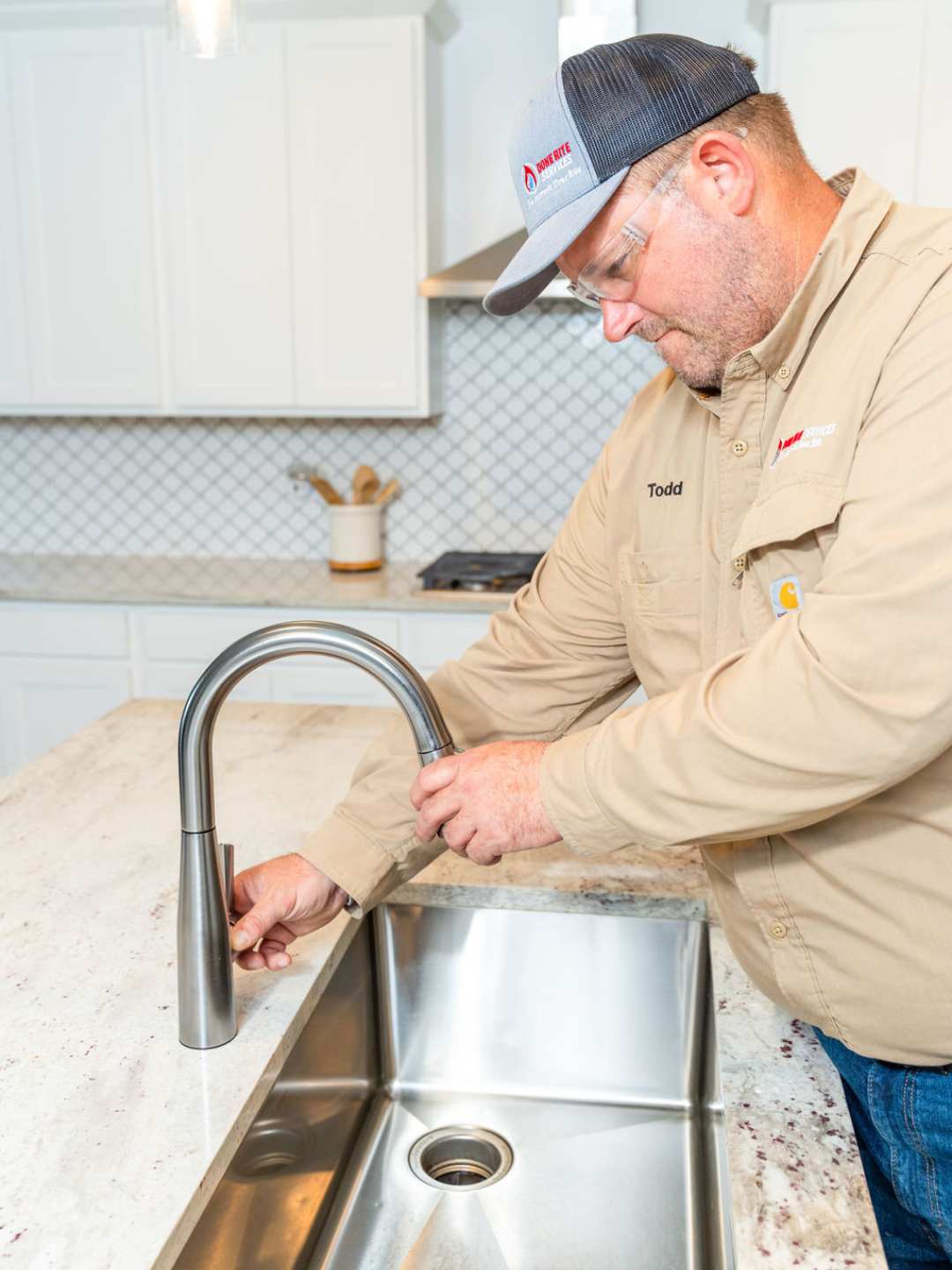 Plumber completing a permanent repair in a Tucson home