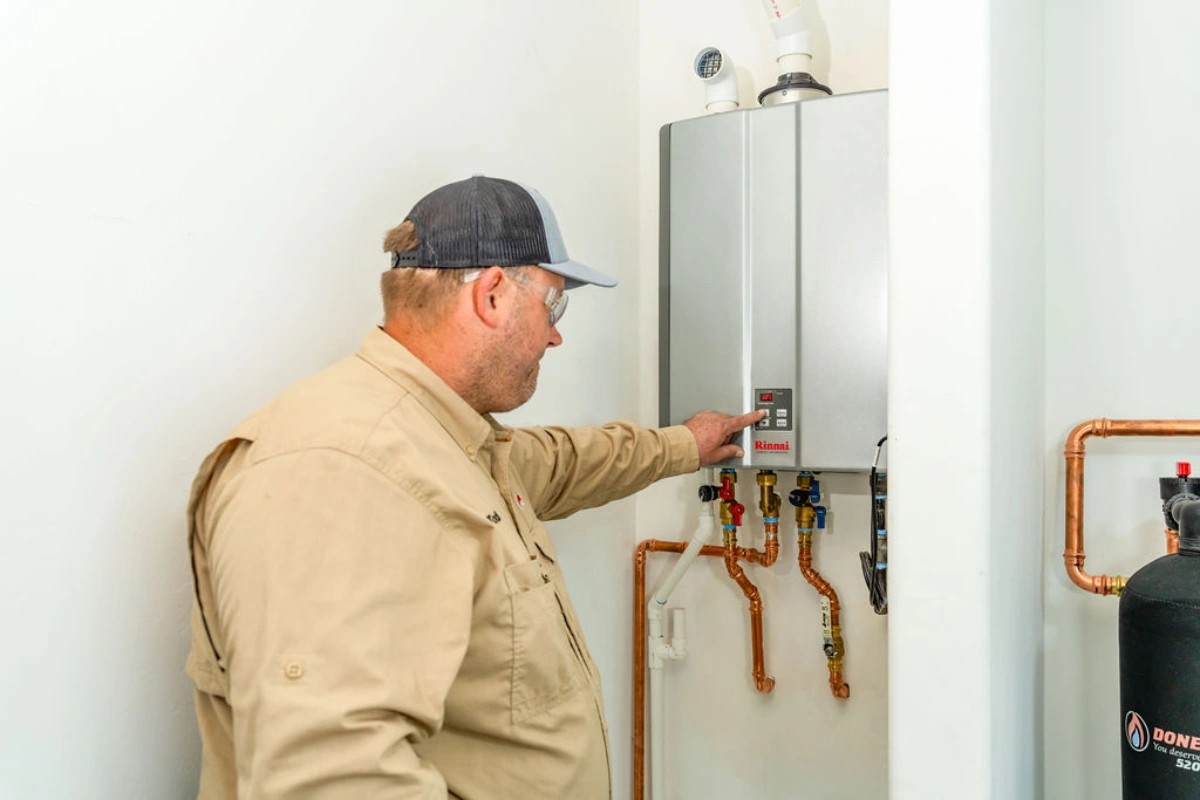 Tankless water heater mounted in a Tucson garage