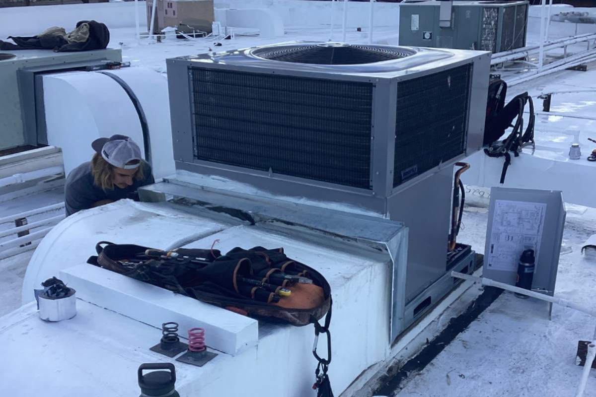 HVAC system being inspected and assessed in Tucson