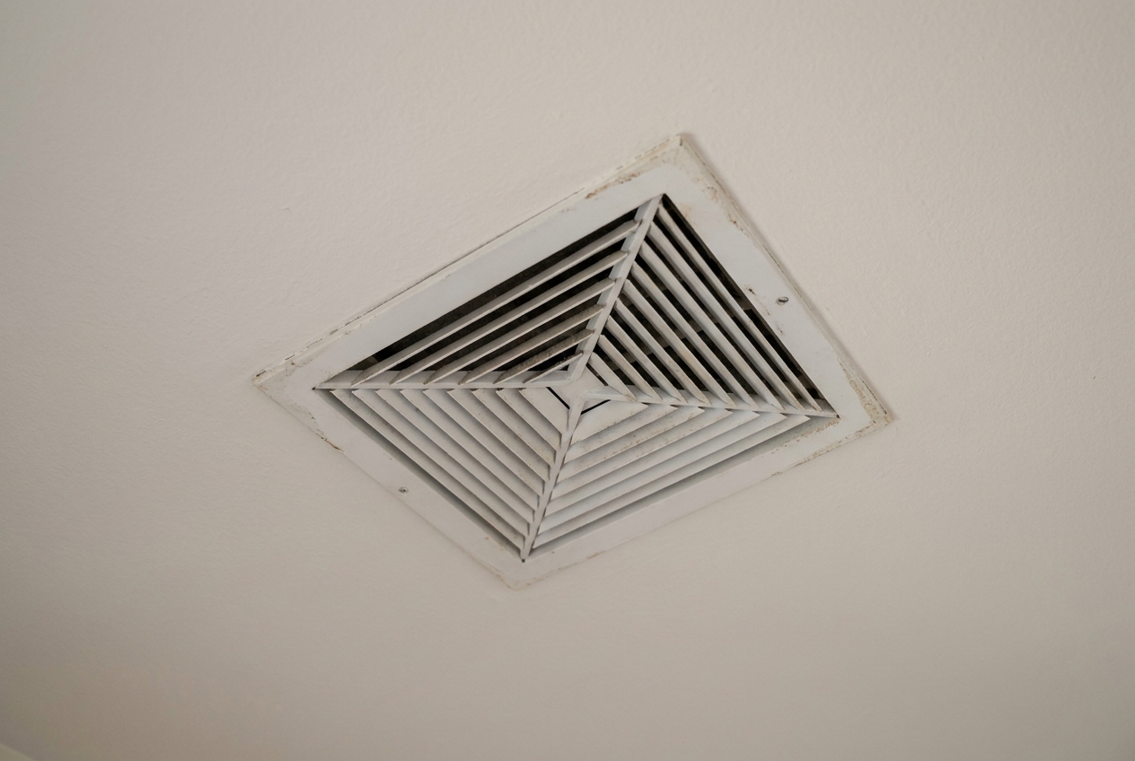 Ceiling supply air register in a Tucson home with its vanes open