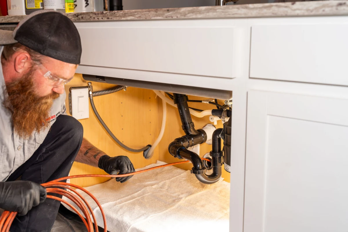 Plumber running new supply lines during a repipe in Tucson