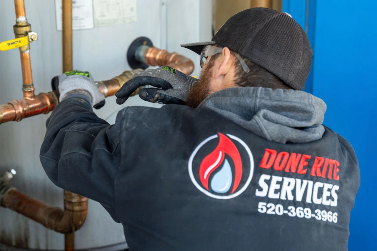 Technician diagnosing a water heater fault