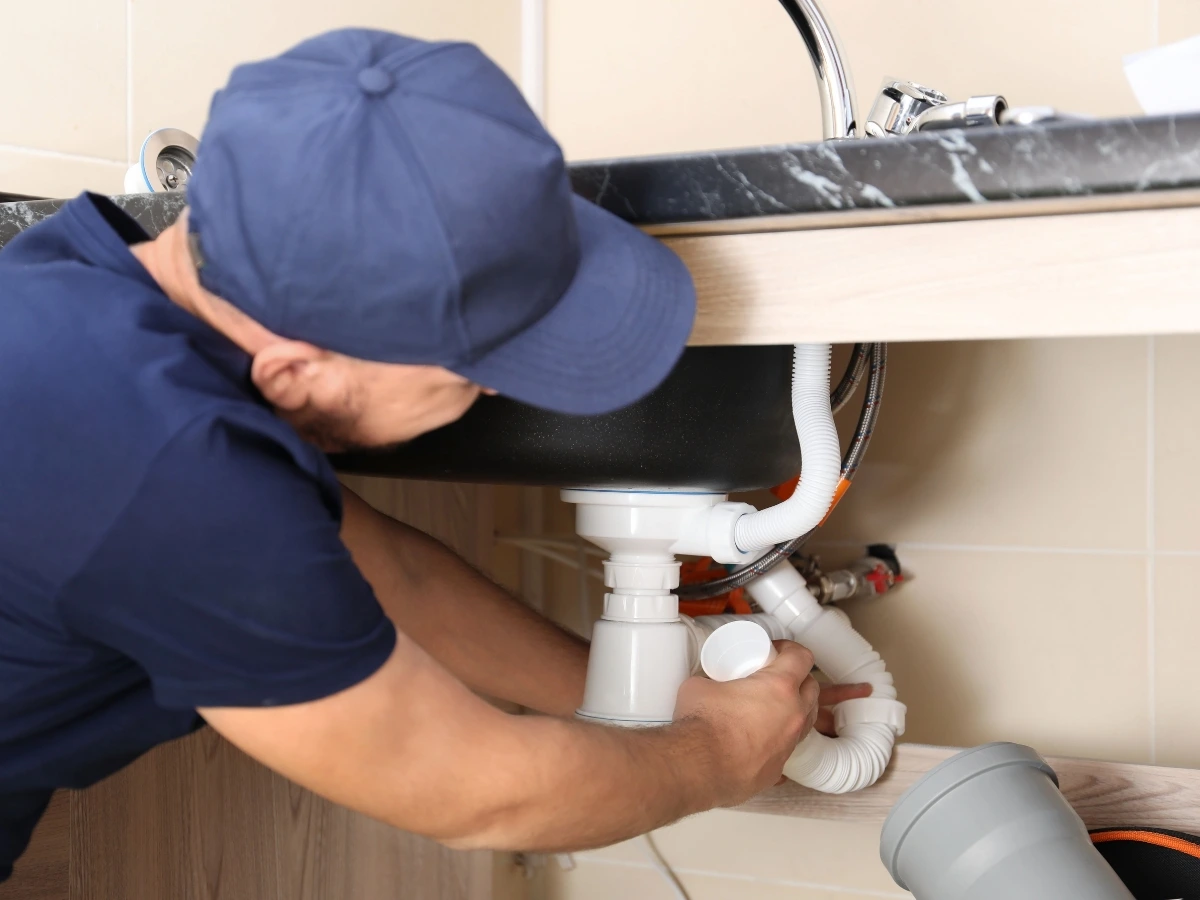 Plumber replacing supply lines during a repipe in Tucson