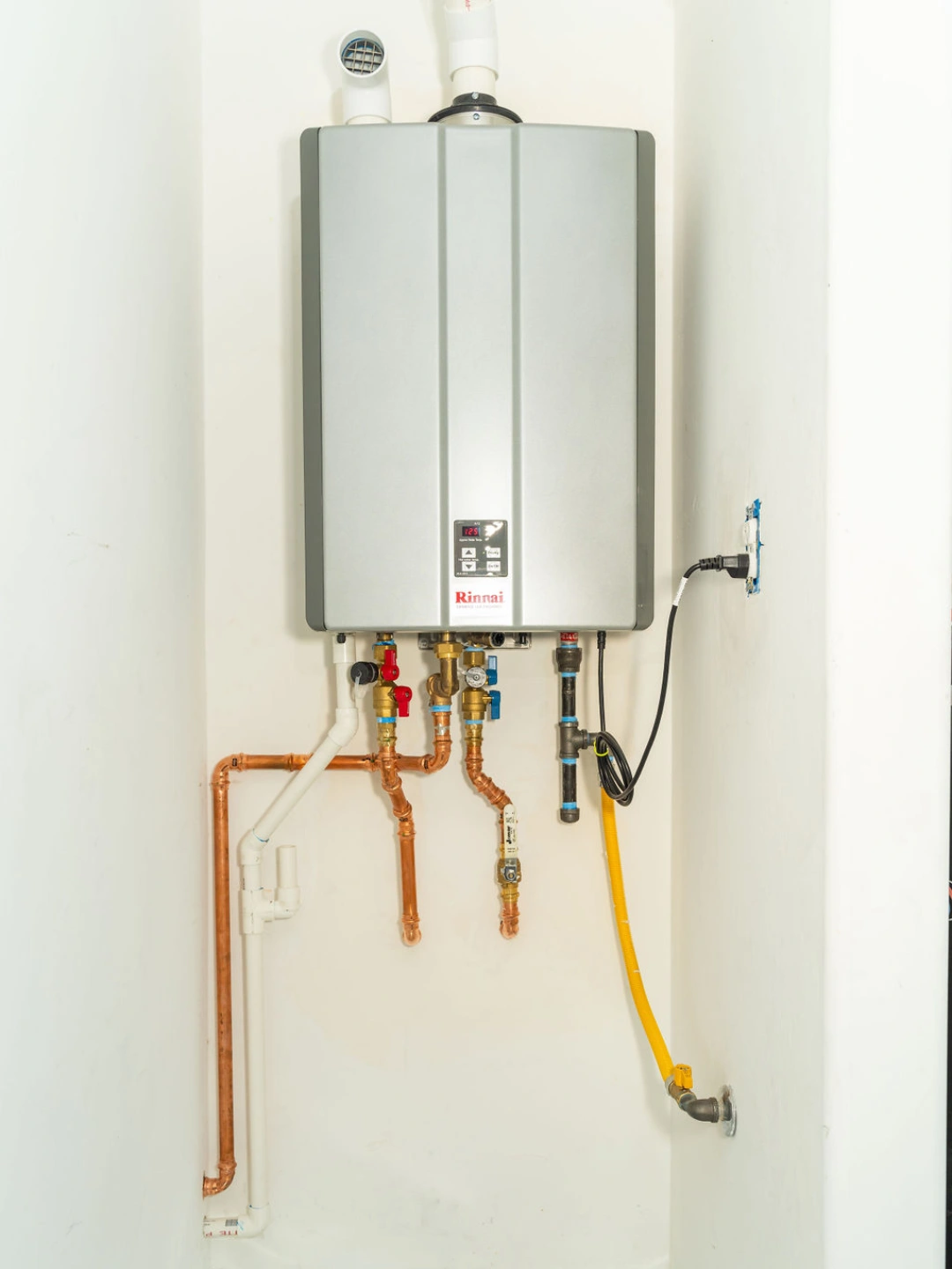 Wall-mounted tankless water heater installed in Tucson