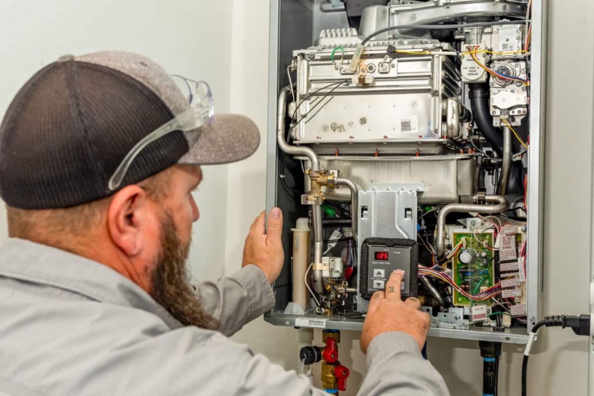 Completed water heater installation being tested